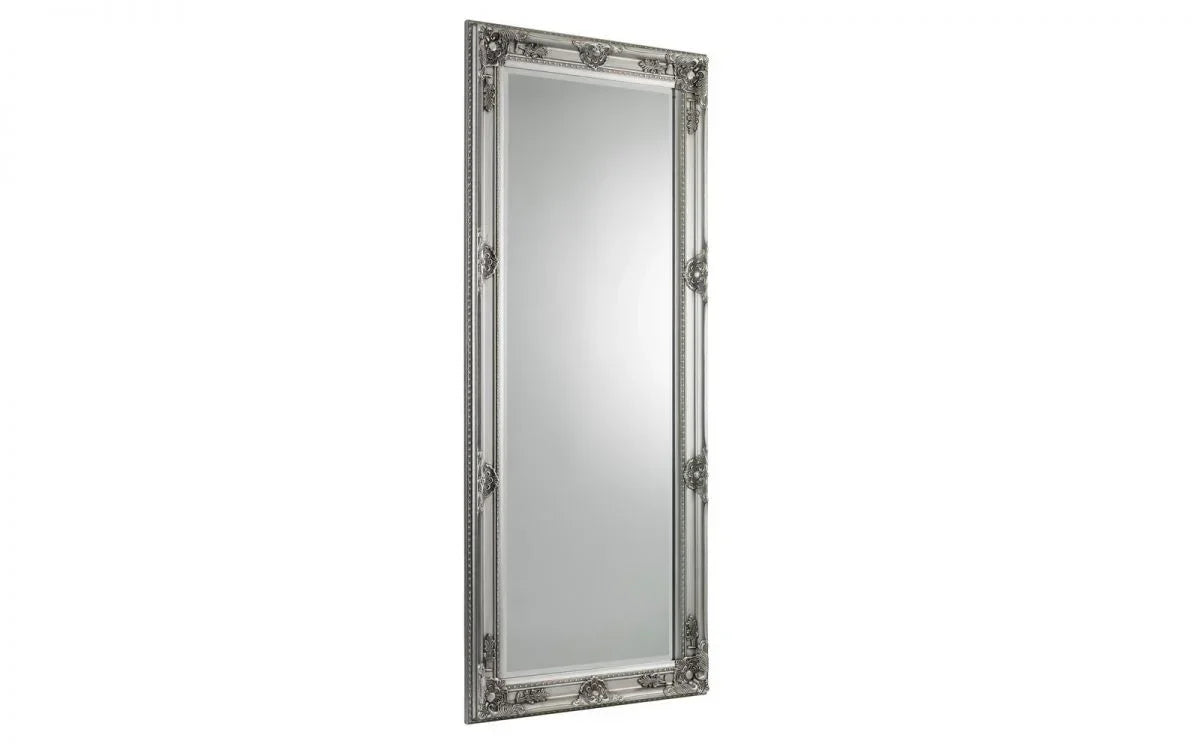Tall rectangular silver mirror with ornate decorative frame detailing
