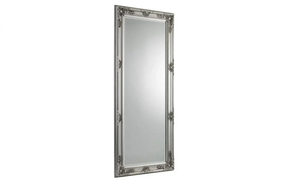 Tall rectangular silver mirror with ornate decorative frame detailing