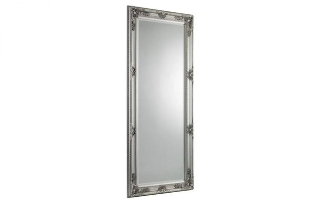 Tall rectangular silver mirror with ornate decorative frame detailing