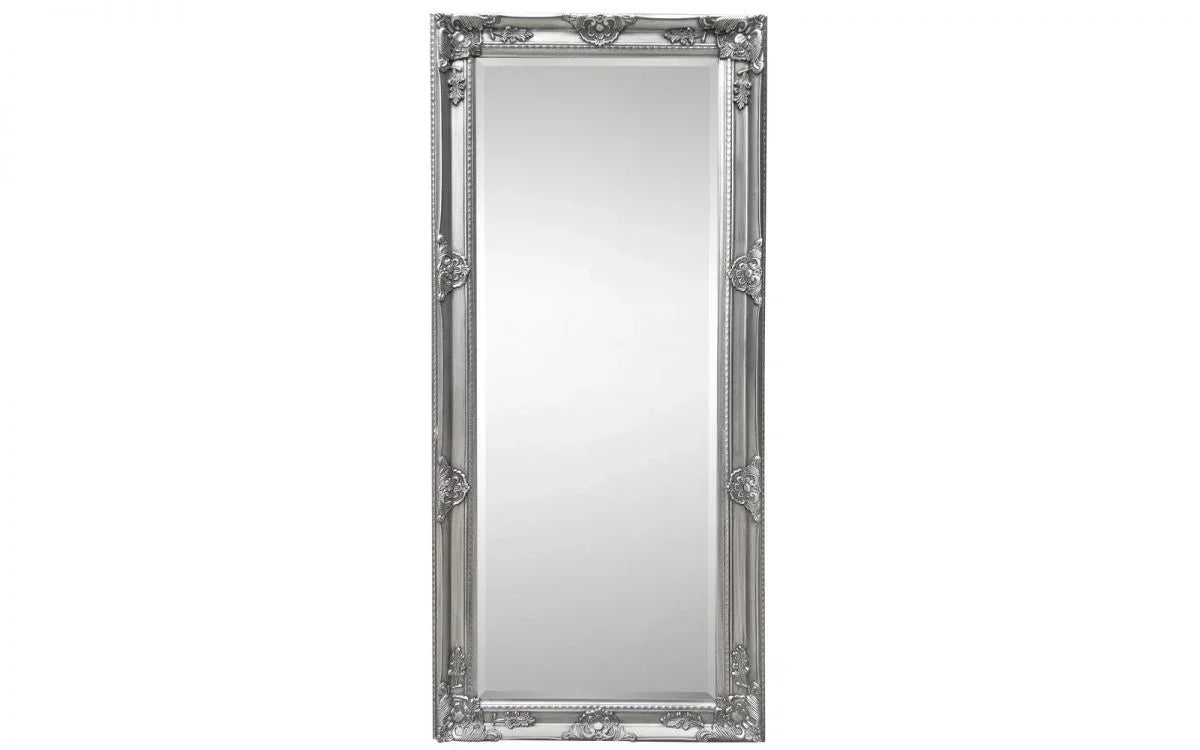 Large rectangular wall mirror with ornate silver frame and decorative floral accents