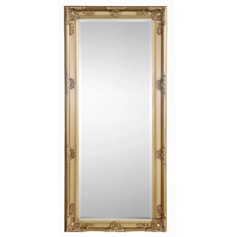 Gold dress mirror with ornate frame and full-length reflective surface