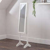 White jewellery mirror with tilting frame on wooden floor in modern bedroom corner