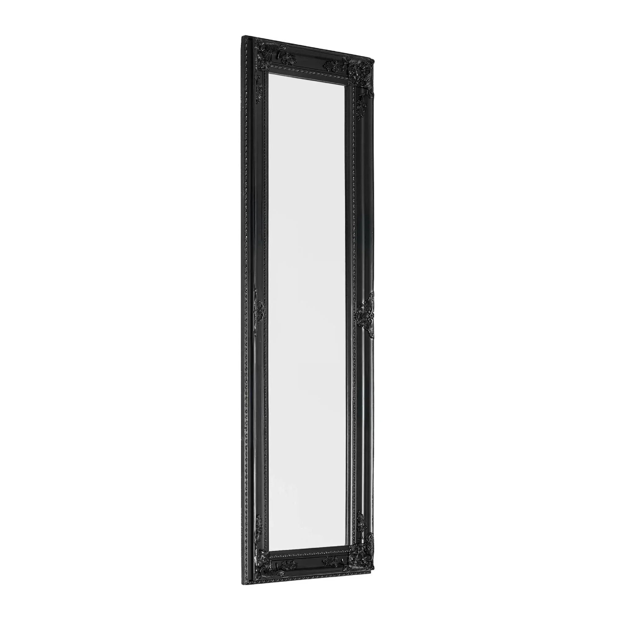 Tall black ornate wall mirror with decorative frame, angled view
