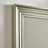 Silver wall mirror with bevelled edge frame against white background
