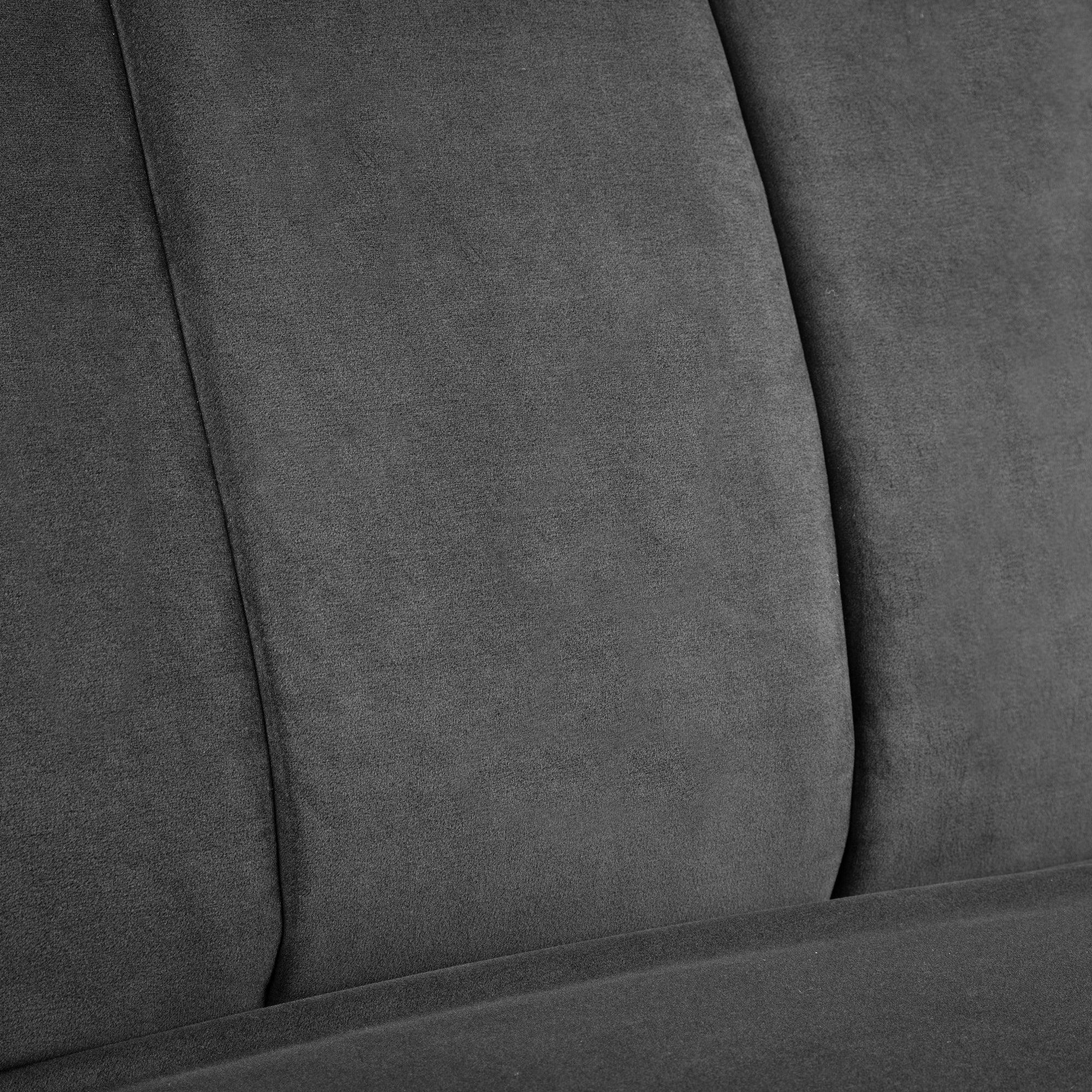 Close-up of grey fabric sofa upholstery with stitched vertical panels