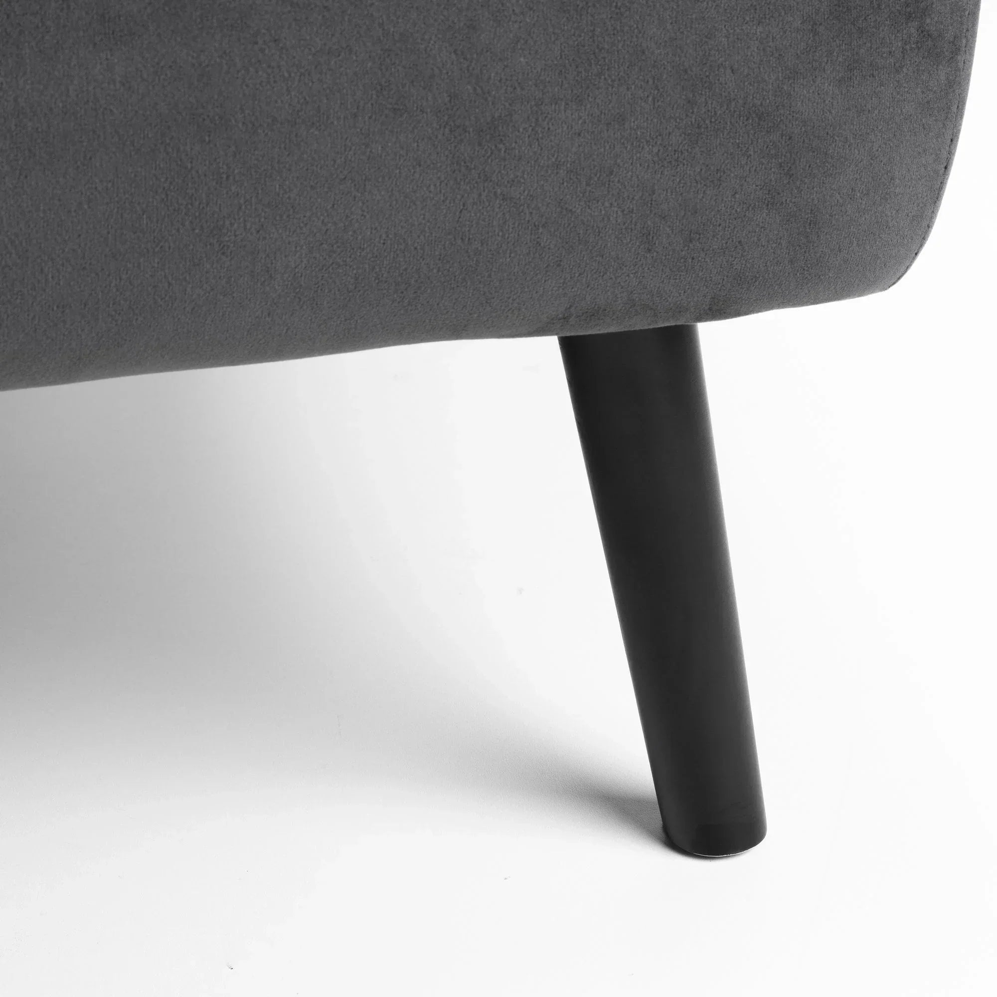 Dark wooden sofa leg with grey upholstered fabric shown against white background