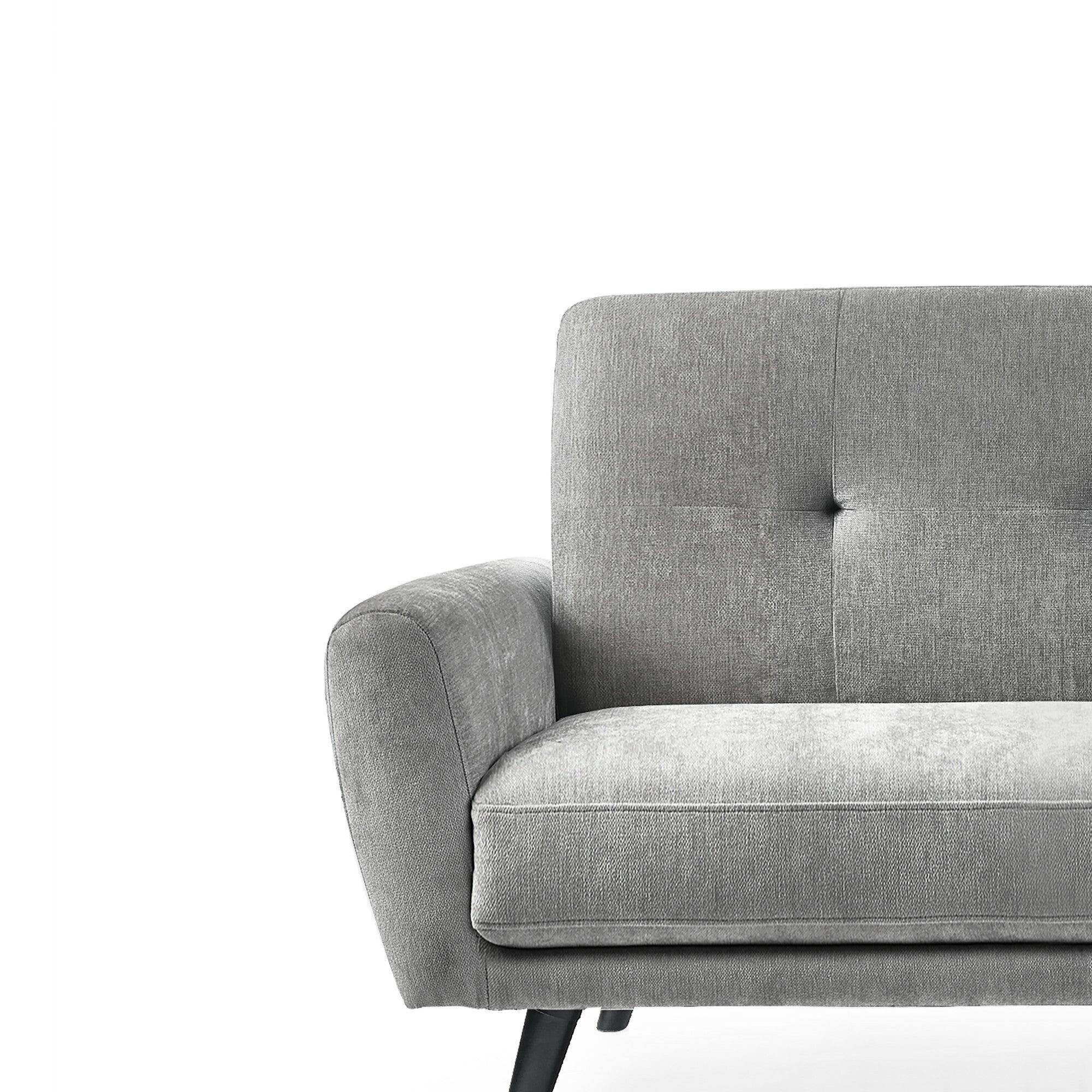 Grey fabric sofa with button-tufted backrest and angled black legs, front view detail