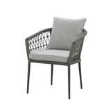 Grey woven garden armchair with soft seat and back cushions on white background