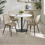 Four beige upholstered dining chairs with black legs around a round white table in a room with light wood floors and shelves.