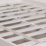 White wooden bed frame slats with two fabric support straps closeup