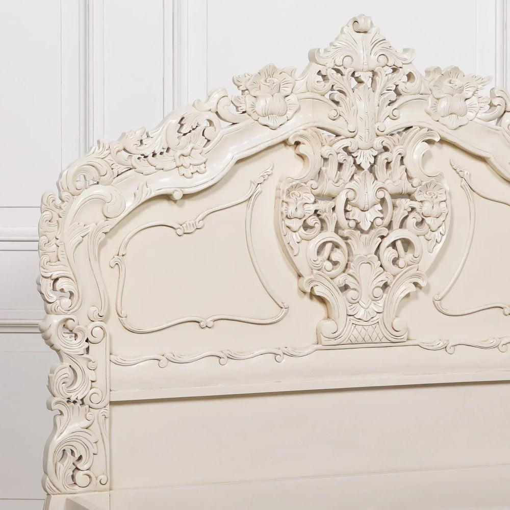 Cream carved wooden bed frame headboard with ornate floral detailing