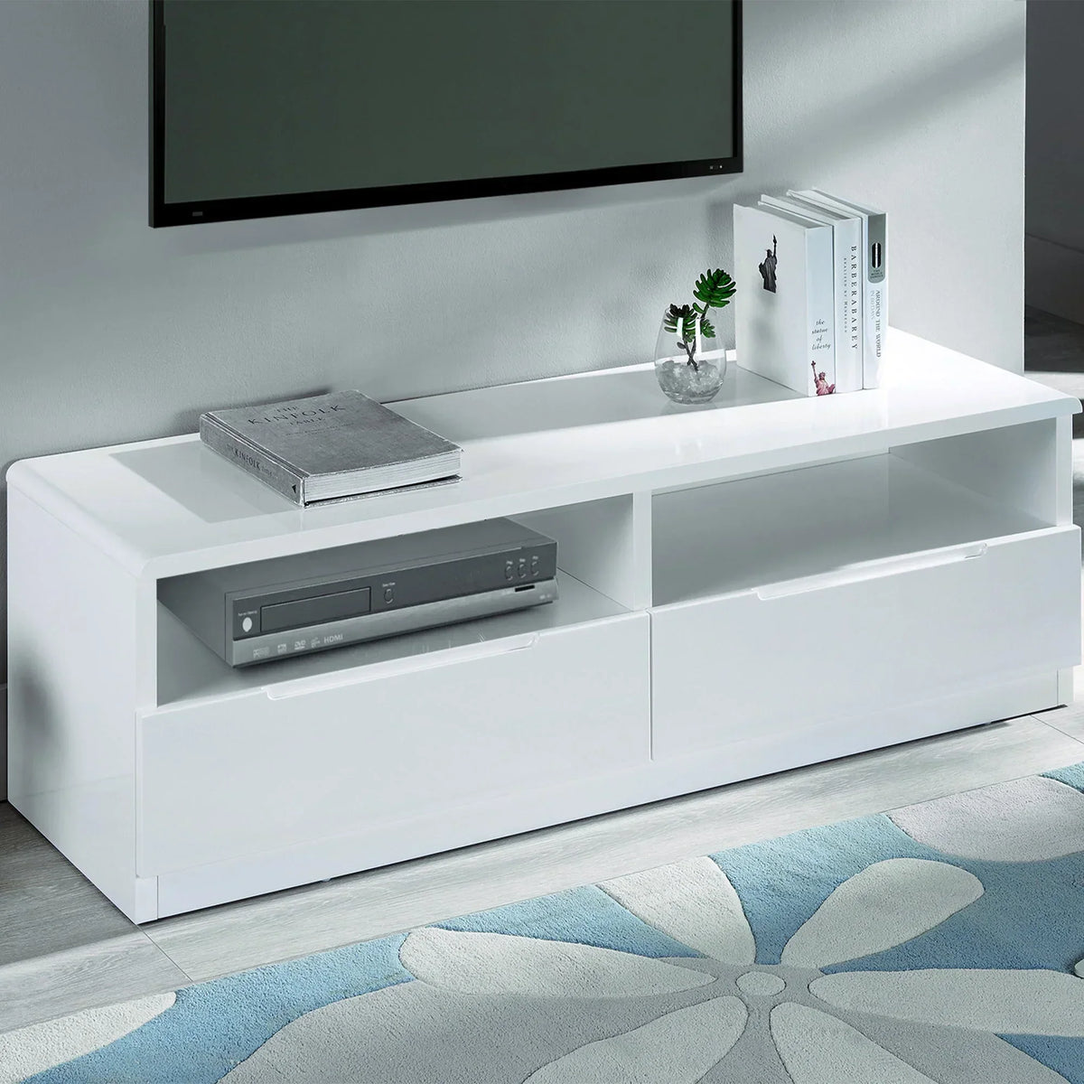 White gloss media unit with shelves, drawers, and TV displayed in a modern living room