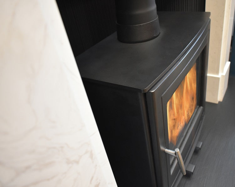 Mourne Eco 8 stove burning wood fuel, showcasing clean flame and heat output