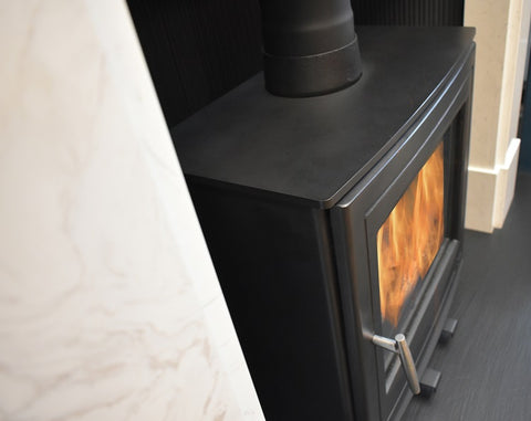 Mourne Eco 8 stove burning wood fuel, showcasing clean flame and heat output