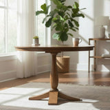 Wooden round table with a plant and mug in a bright room