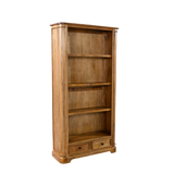 Wooden bookshelf with four shelves and two drawers on a white background