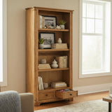 Wooden bookshelf with decorative items in a room with a window