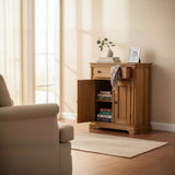 Wooden cabinet with open door displaying books and decor items in a room with a beige wall and carpet.