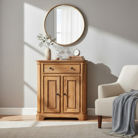 Wooden cabinet with round mirror above it in a room with a chair and plant.