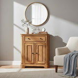 Wooden cabinet with round mirror above it in a room with a chair and plant.