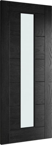 Black interior door with vertical frosted glass panel and wood grain finish, angled view