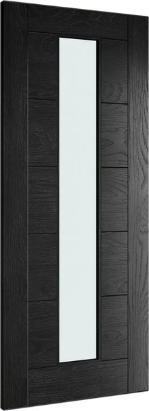 Black interior door with vertical frosted glass panel and wood grain finish, angled view