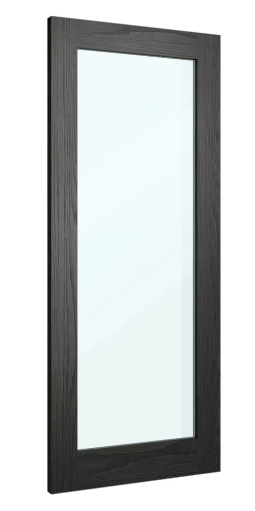 Tall wall mirror with black wood frame photographed from side angle