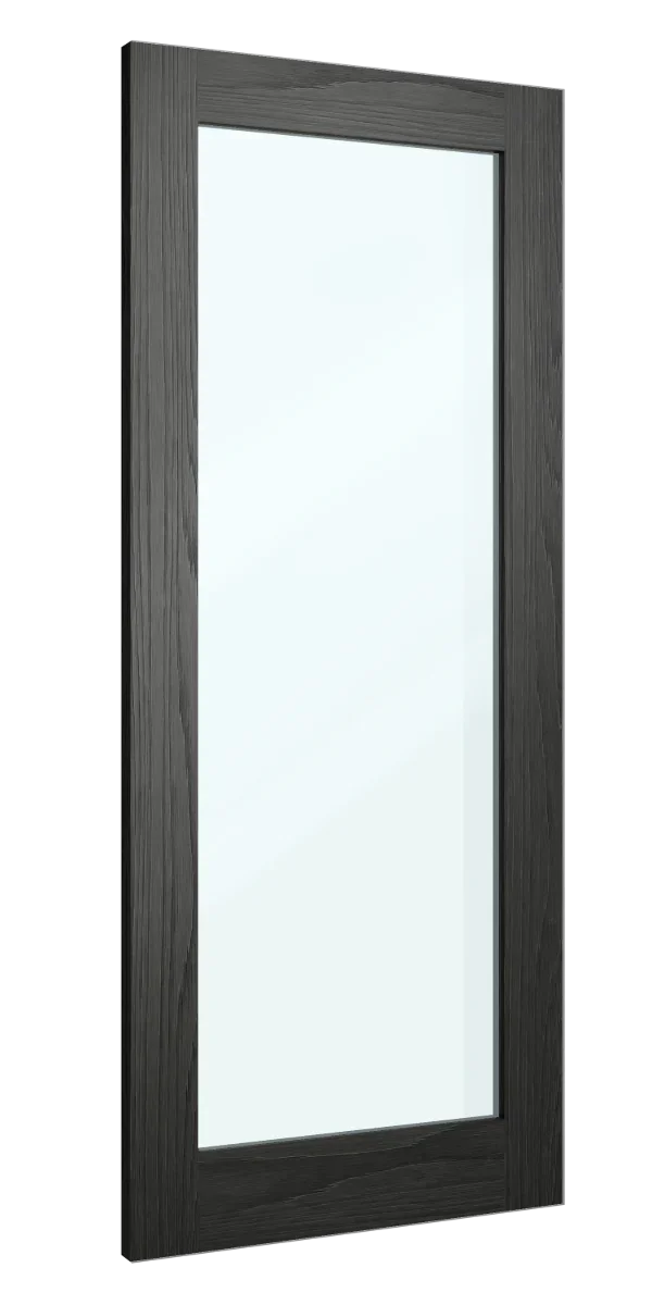 Tall wall mirror with black wood frame photographed from side angle
