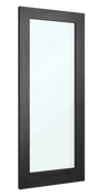 Tall wall mirror with black wood frame photographed from side angle