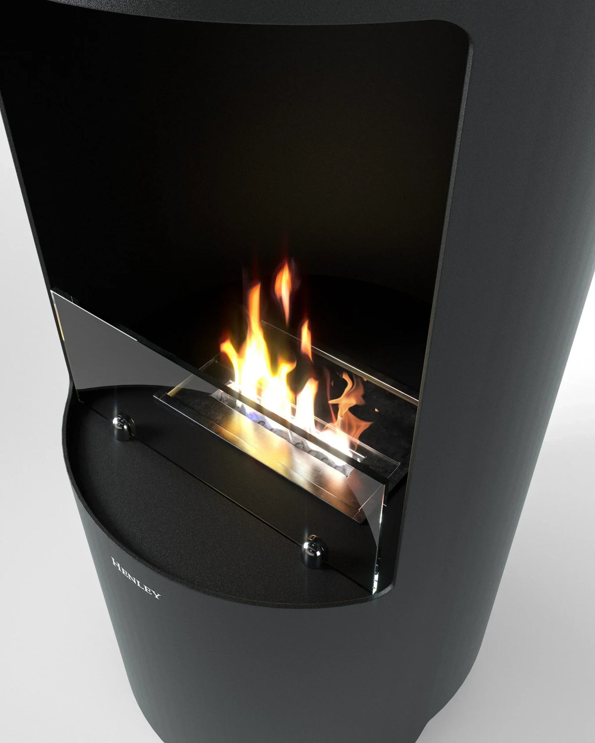 Modern black freestanding fireplace with visible flame and glass fireguard