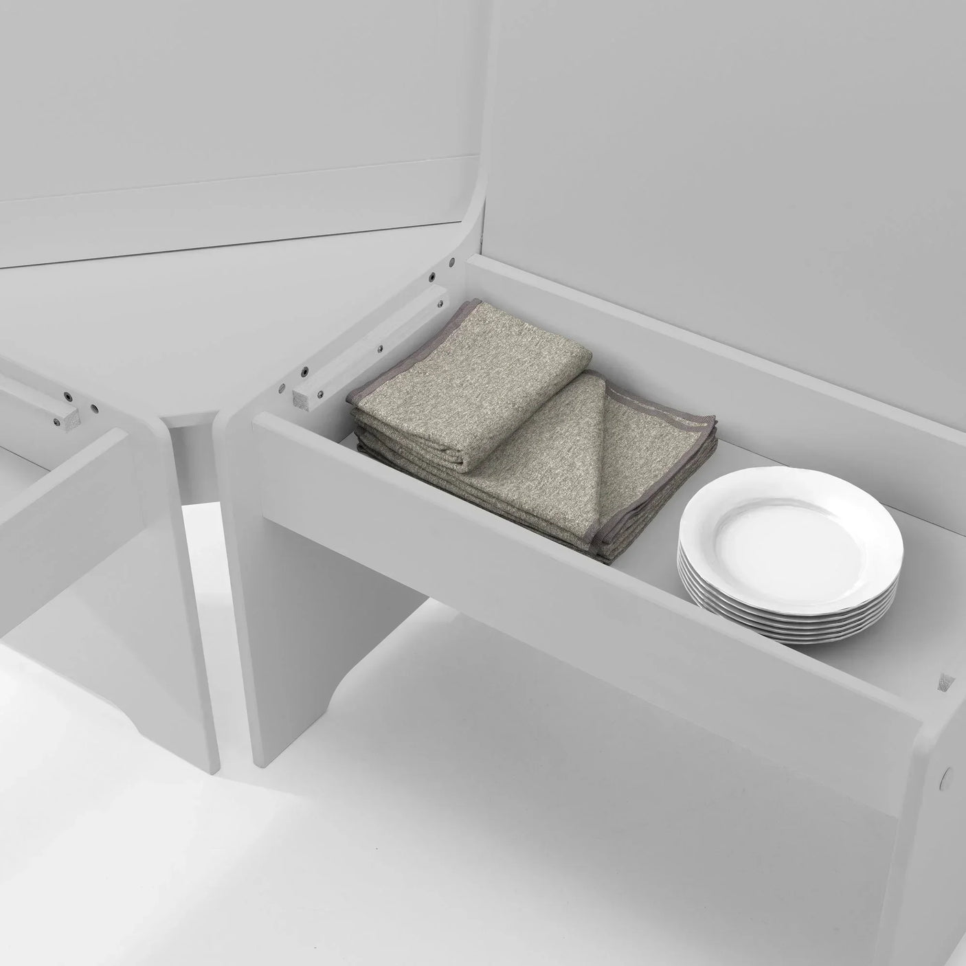 Dove grey corner dining set bench storage with folded napkins and stacked plates inside