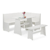 White wooden corner dining set with matching table, L-shaped bench and standalone bench