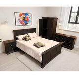 A dark brown wooden bedroom furniture set including a bed frame, nightstand, dresser, and wardrobe, styled in a modern bedroom with white bedding and decorative pillows.