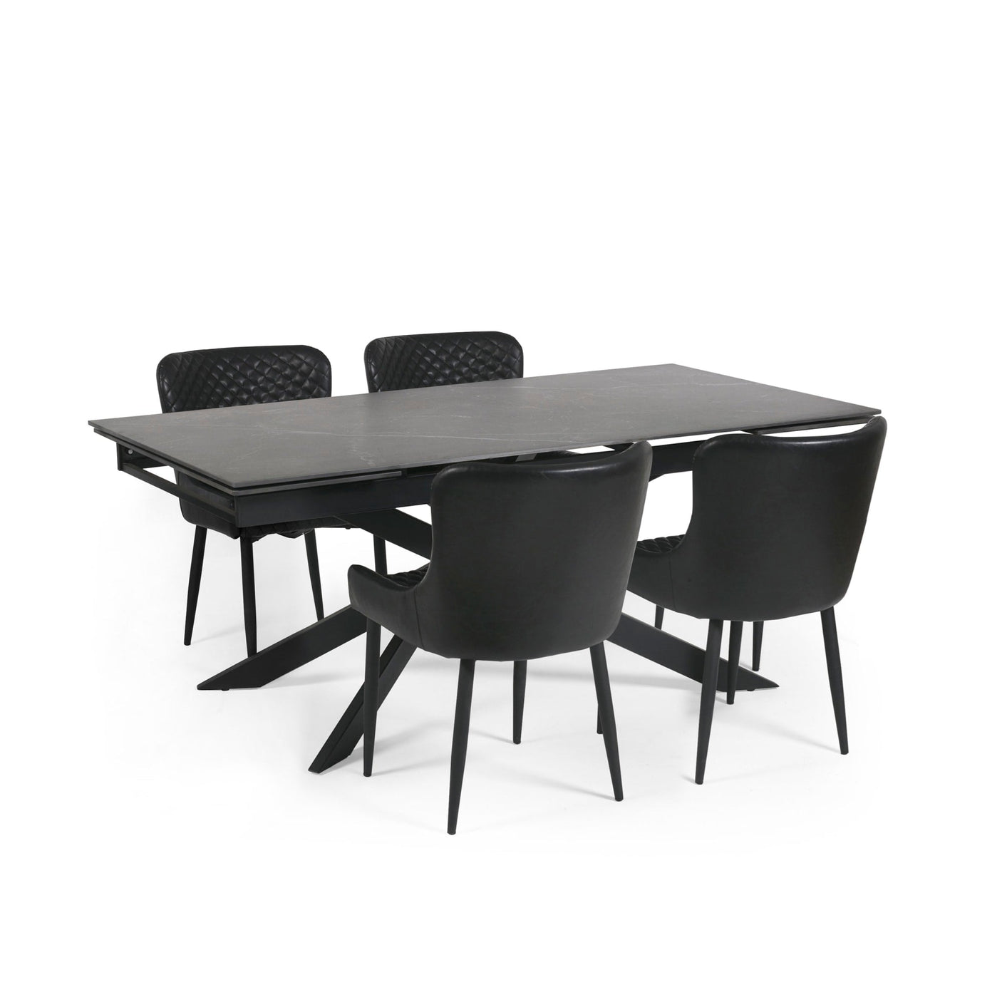 Black extending dining table with four black leather upholstered chairs featuring quilted backs.