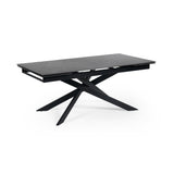 Rectangular matte black extending dining table with crossed metal base, isolated on white background