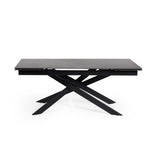 Rectangular dining table with black marble top and black crossed metal legs, side view isolated on white