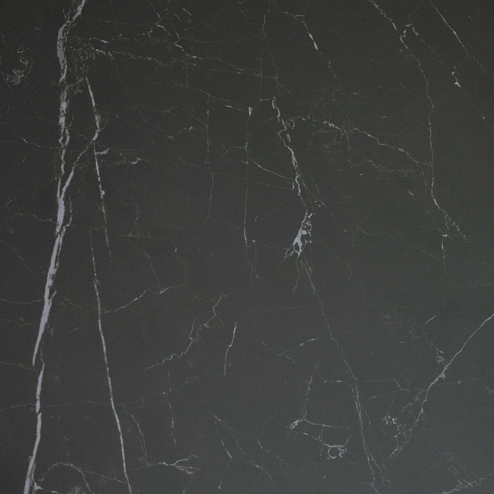 Close-up of black marble tabletop surface showing natural white veining detail