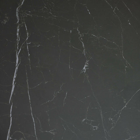 Close-up of black marble tabletop surface showing natural white veining detail