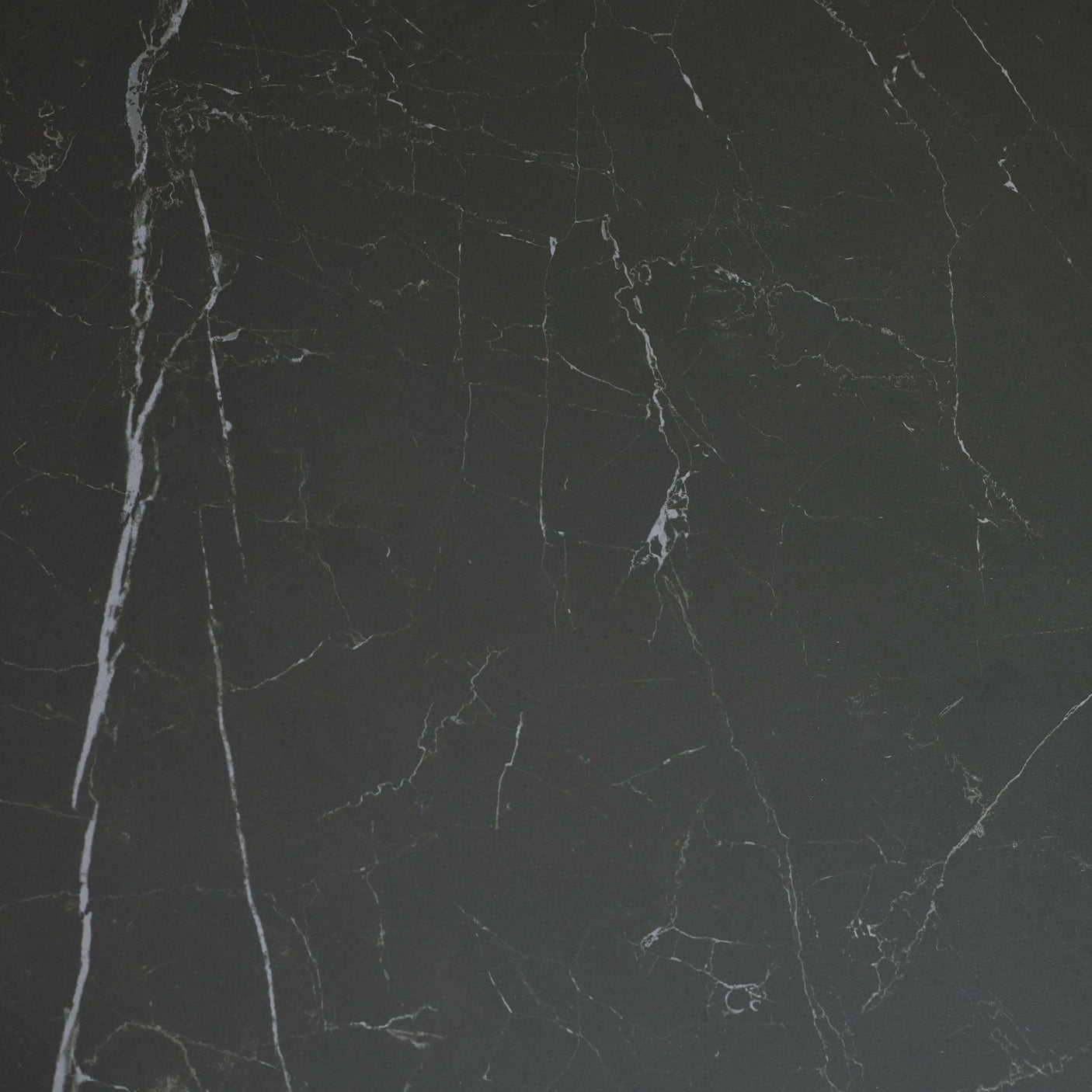 Close-up of black marble tabletop surface showing natural white veining detail