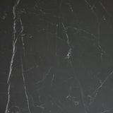 Close-up of black marble tabletop surface showing natural white veining detail