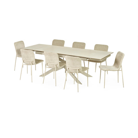 Extended light beige dining table with six cream upholstered chairs on white background, front angle