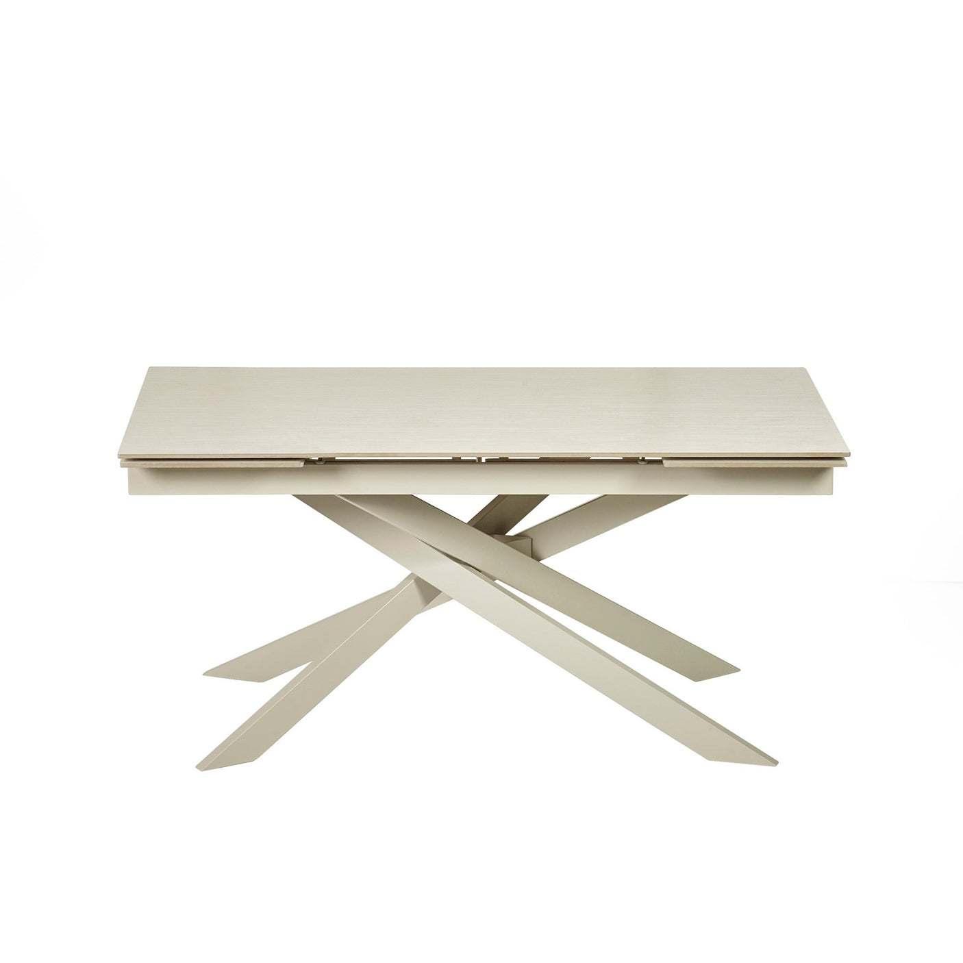 Front view of closed extending dining table with cream crossed metal legs against a white background