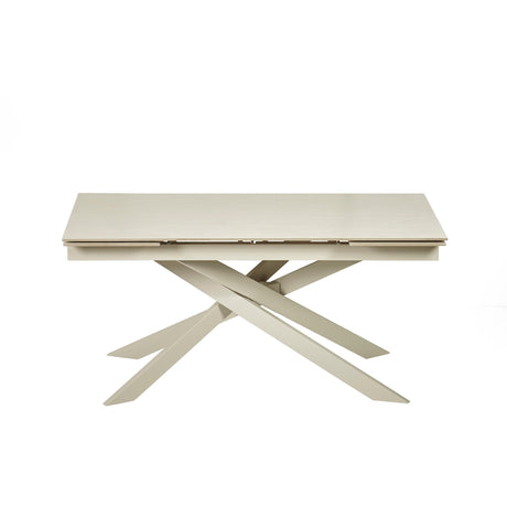 Front view of closed extending dining table with cream crossed metal legs against a white background