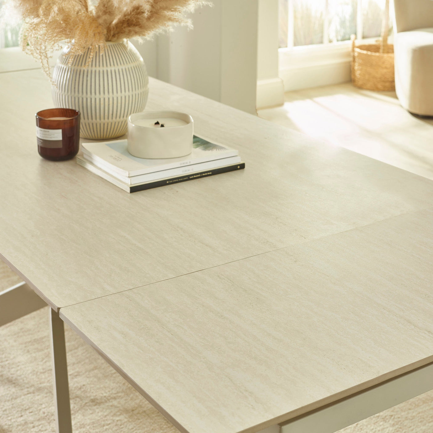 Close-up showing light beige textured tabletop with clean straight edge and slight opening for extender