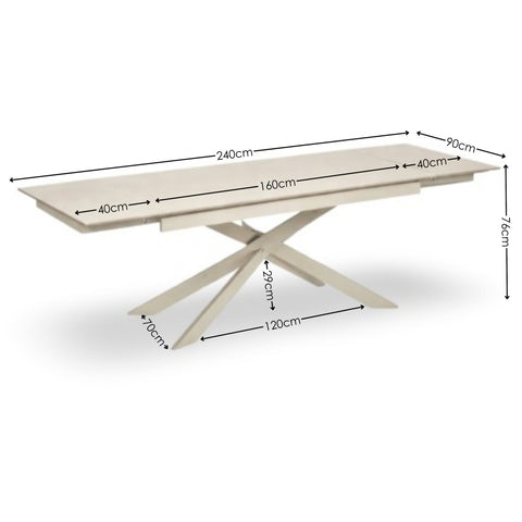 Extending rectangular dining table in light beige with metal crossed base and measurements overlay