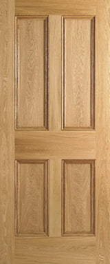 Oak internal door with four raised panels and natural wood grain finish