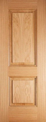 Oak panel interior door with two raised rectangular panels and natural wood grain finish