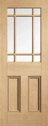 Oak glazed internal door with nine clear glass panels and raised wood panels, front view