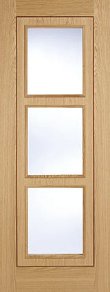 Oak inlay interior door with three clear glass panels in vertical alignment