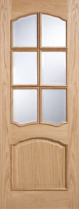 Oak glazed interior door with six clear glass panels and arched wooden detail